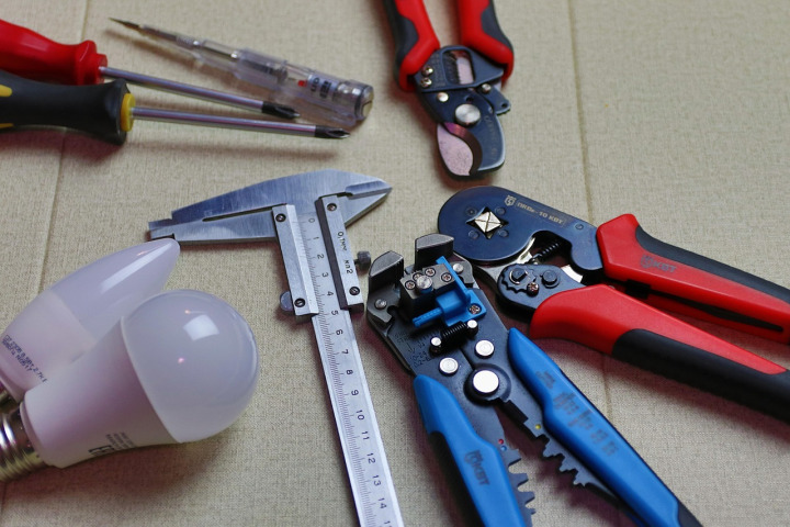 electrician working wiring tools